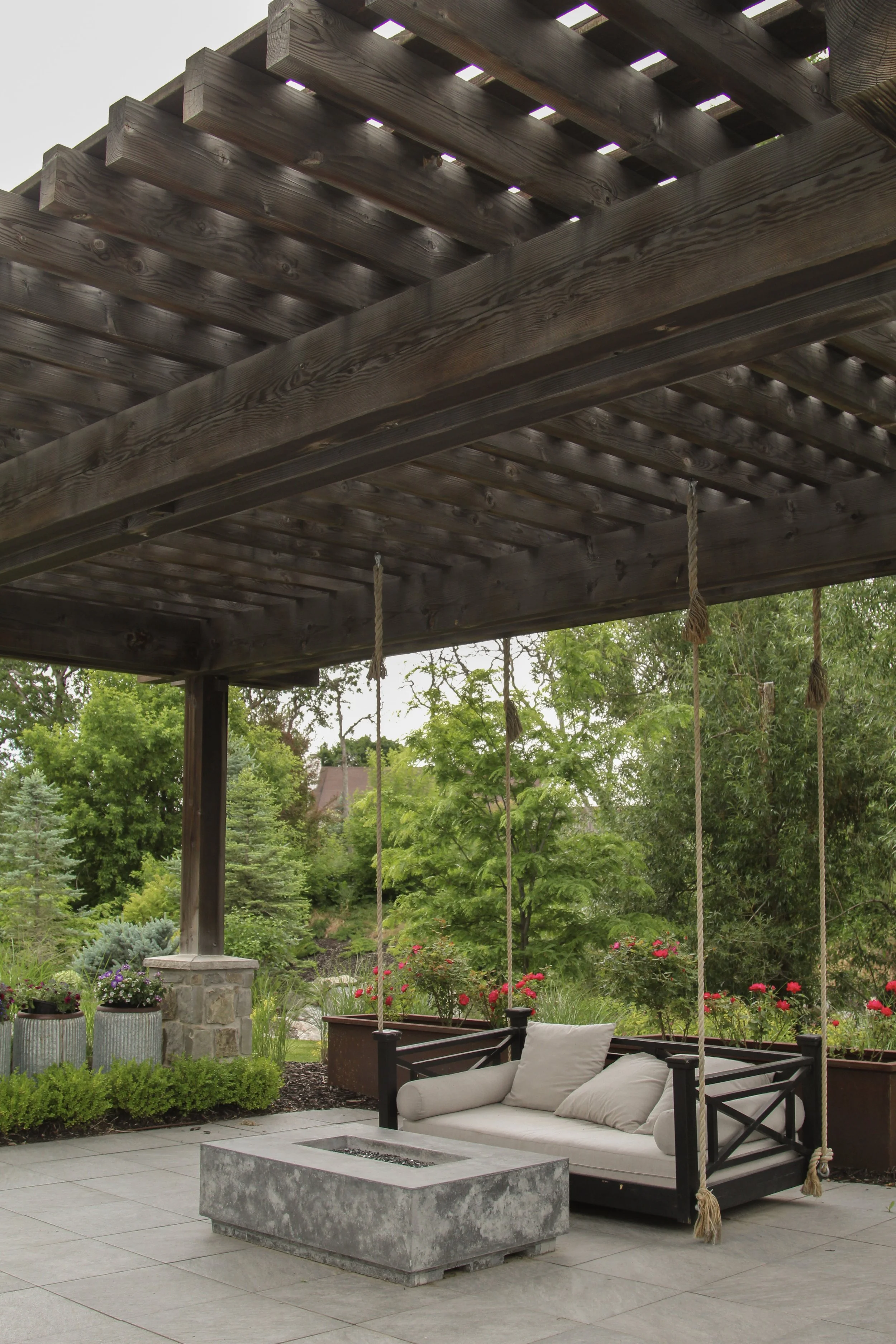 Custom waterfall and koi pond integrated into a serene Davis County backyard garden.