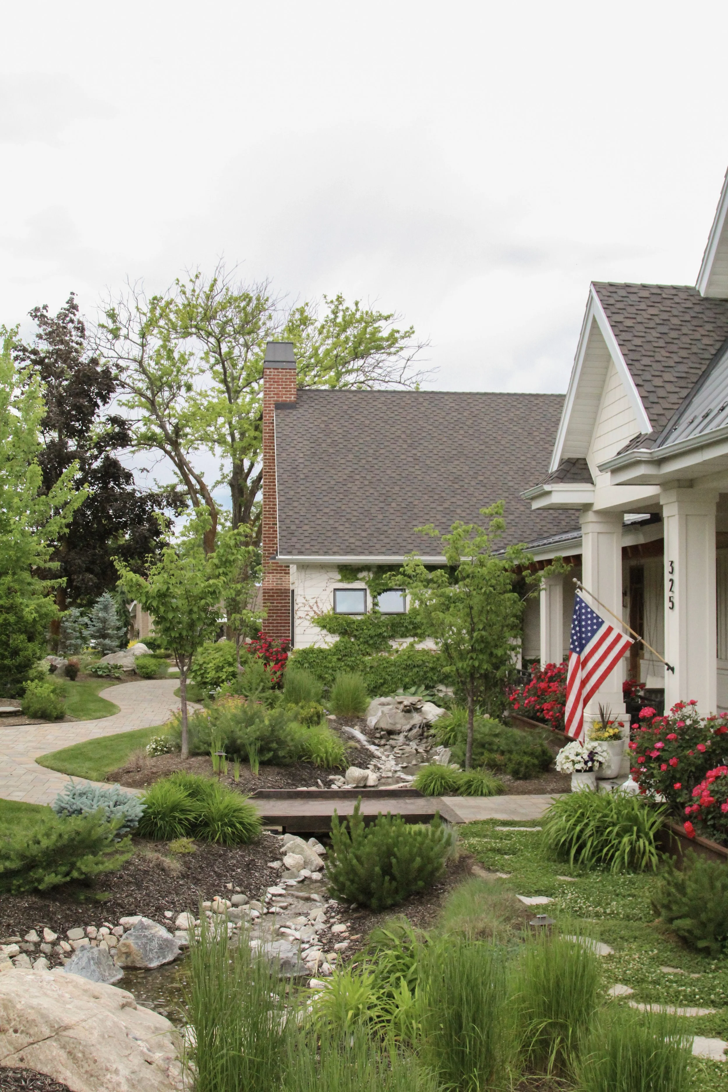 Complete backyard renovation with patio, pergola, and lush plantings tailored to the Ogden climate.